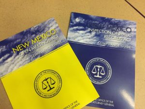 Photograph of the New Mexico Open Meetings Act Guide and the New Mexico Inspection of Public Records Act Guide books.