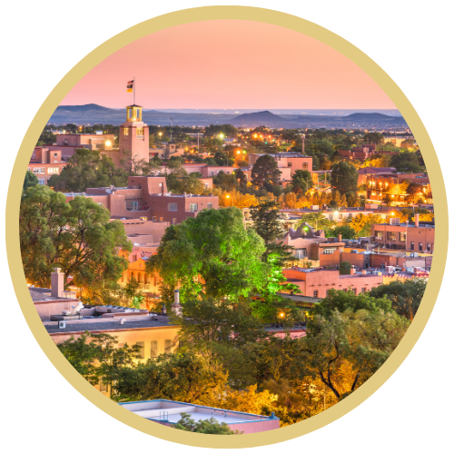 Photograph of Santa Fe New Mexico with a gold, circular frame around it.