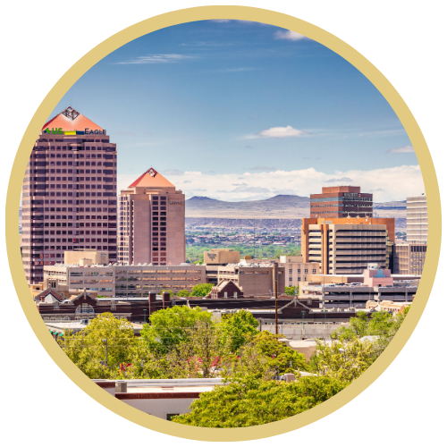 Photograph of Albuquerque, New Mexico with a gold, circular frame around it.